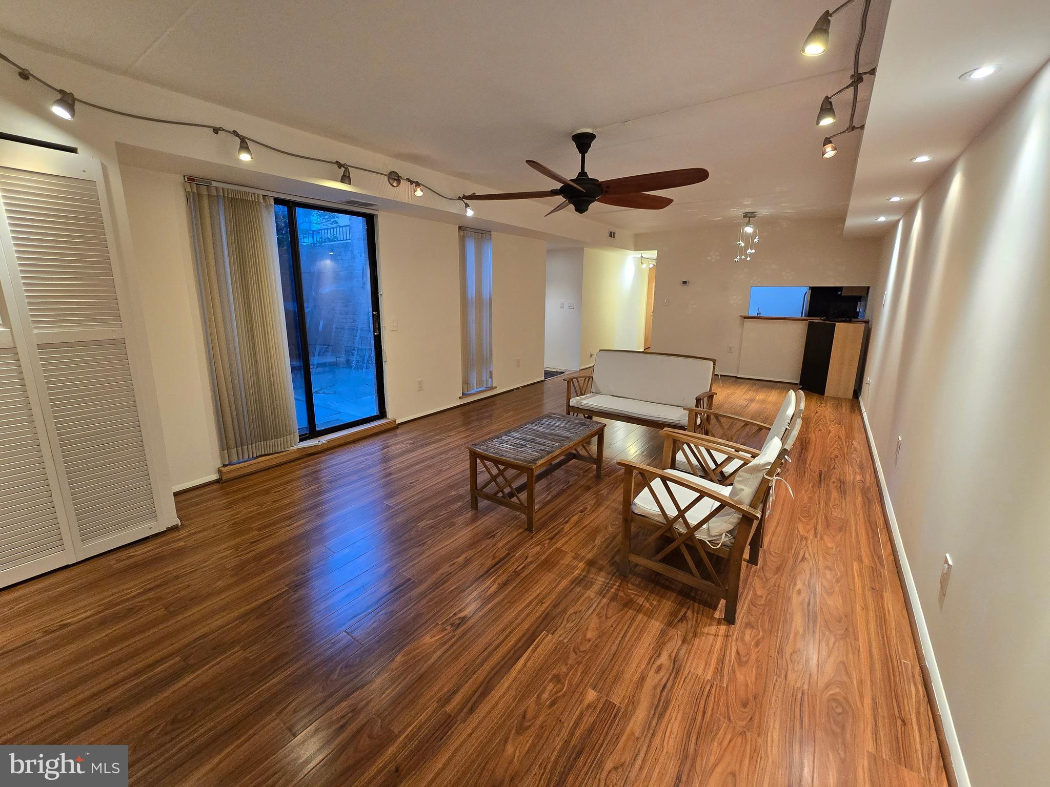 a view of a livingroom with furniture and wooden floor