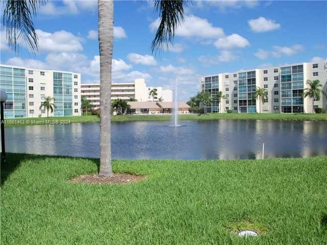 a view of a lake with a big yard