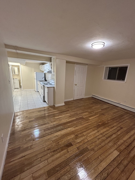 a view of a livingroom with wooden floor