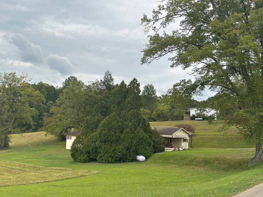 a view of a lake with a yard