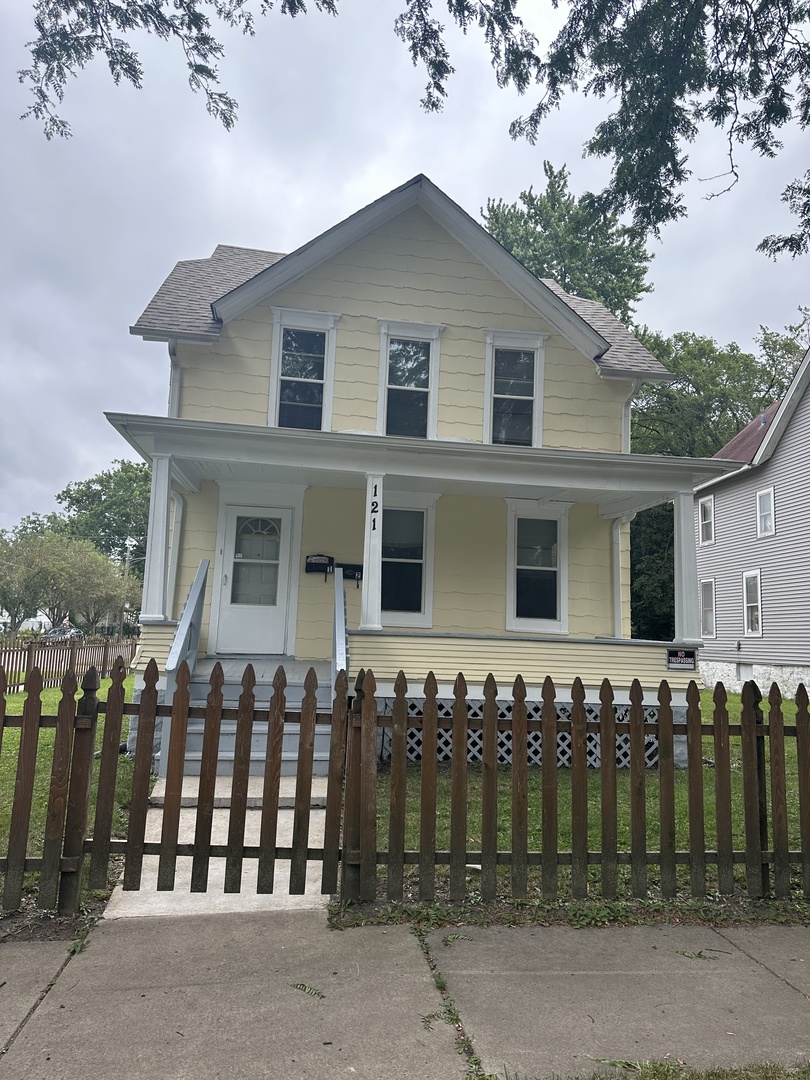 a front view of a house with a garage