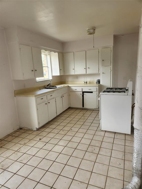 a kitchen with stainless steel appliances granite countertop a sink counter space and cabinets