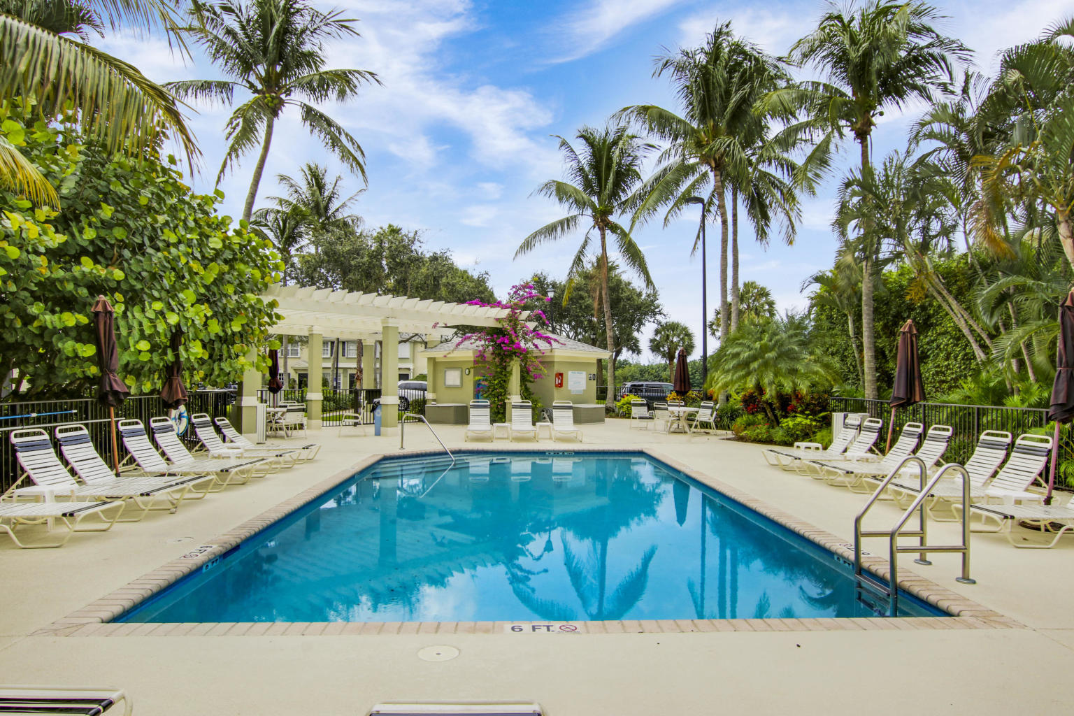 a swimming pool with outdoor seating and yard