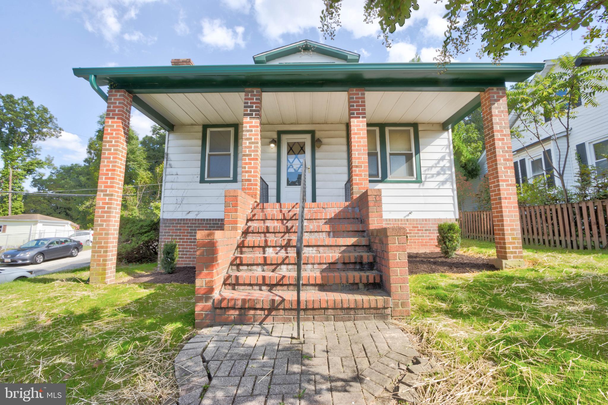 a front view of a house with a porch