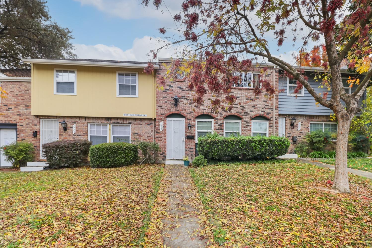 a front view of a house with a yard