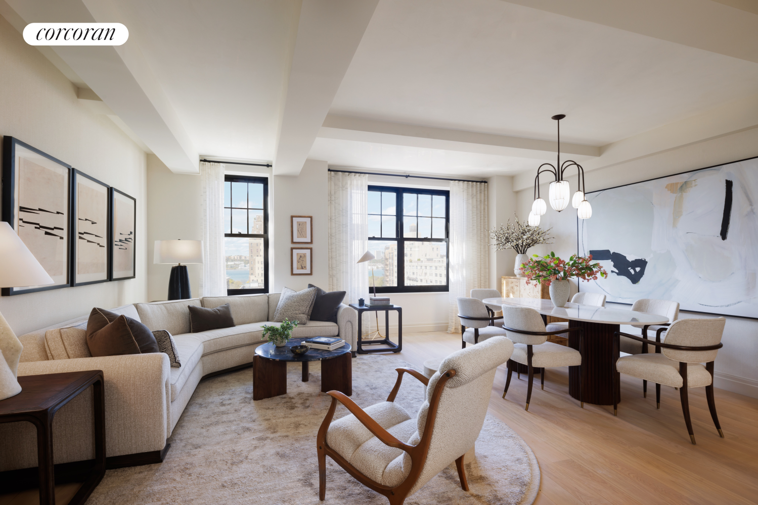 a living room with furniture a chandelier and a window