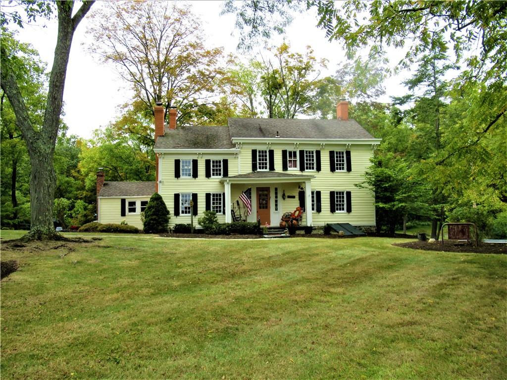 Colonial home with a front lawn