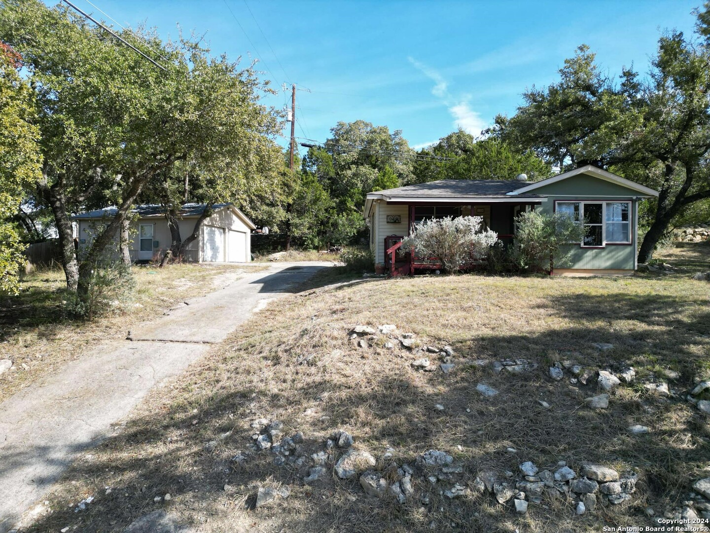 a pathway of a house with a yard