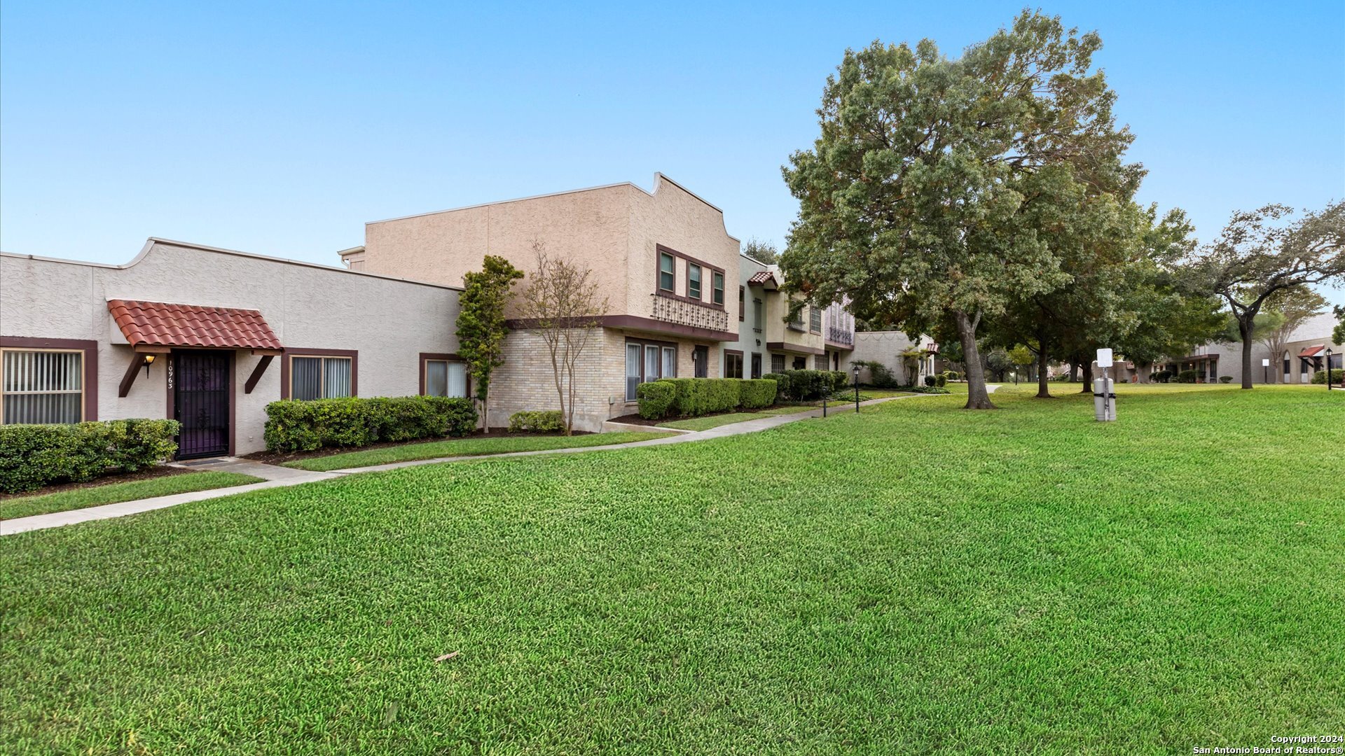 a view of a big yard with a house