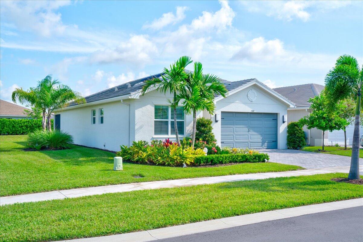 a front view of house with yard and green space