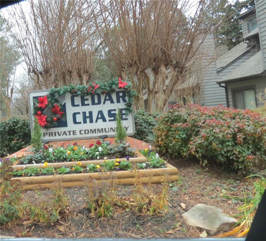 a front view of a house with a yard and flowers