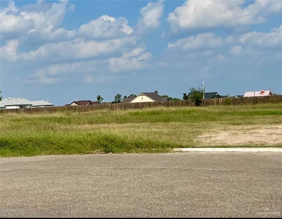 a view of an ocean and a yard