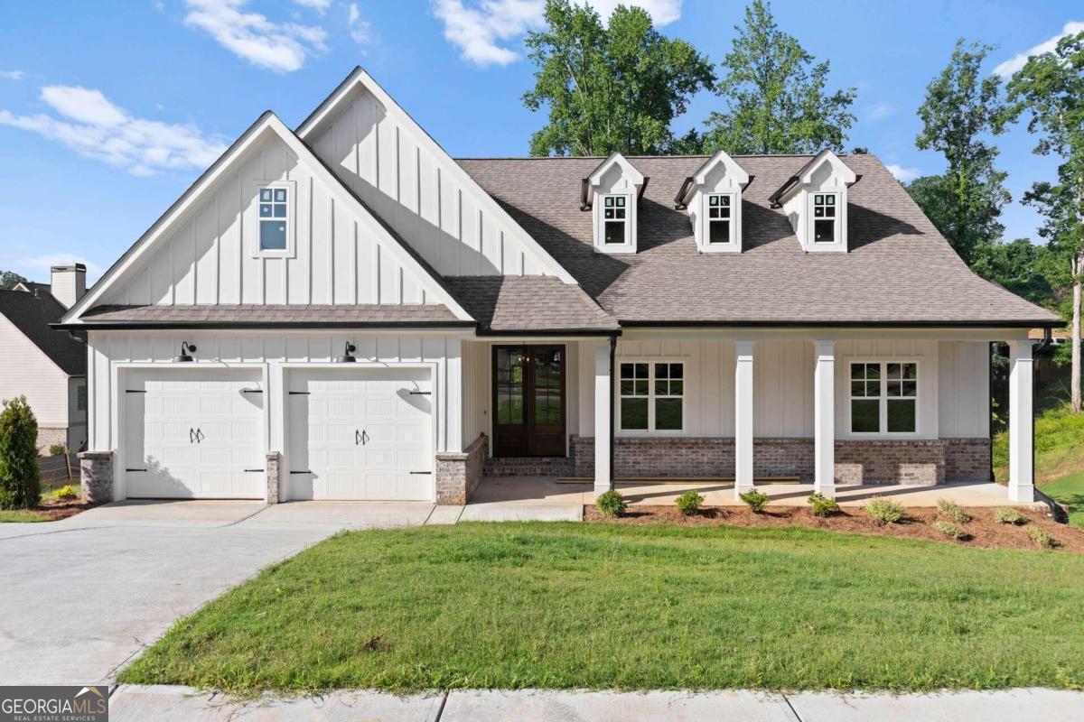 a front view of a house with a yard