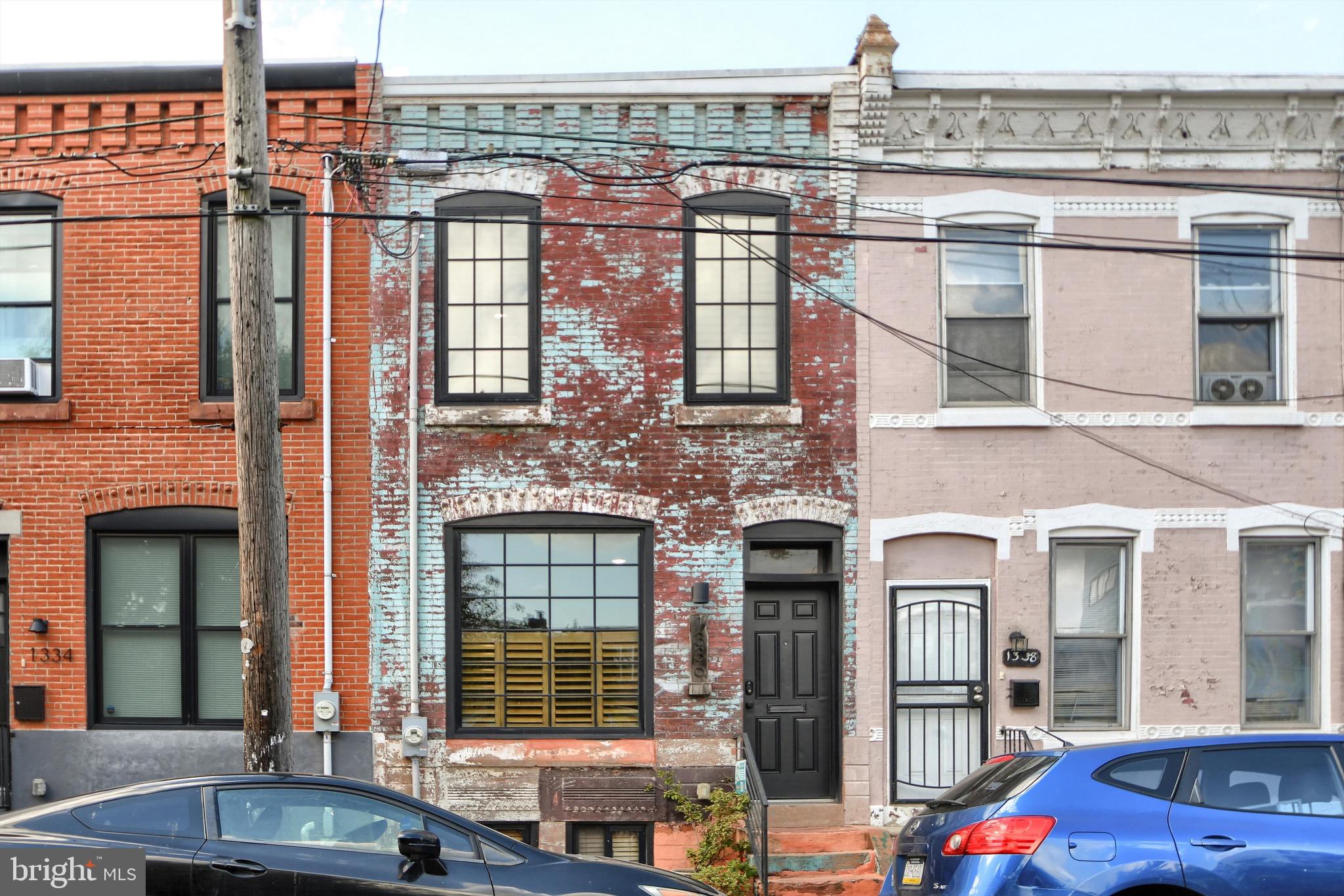 a front view of a building with a lot of windows