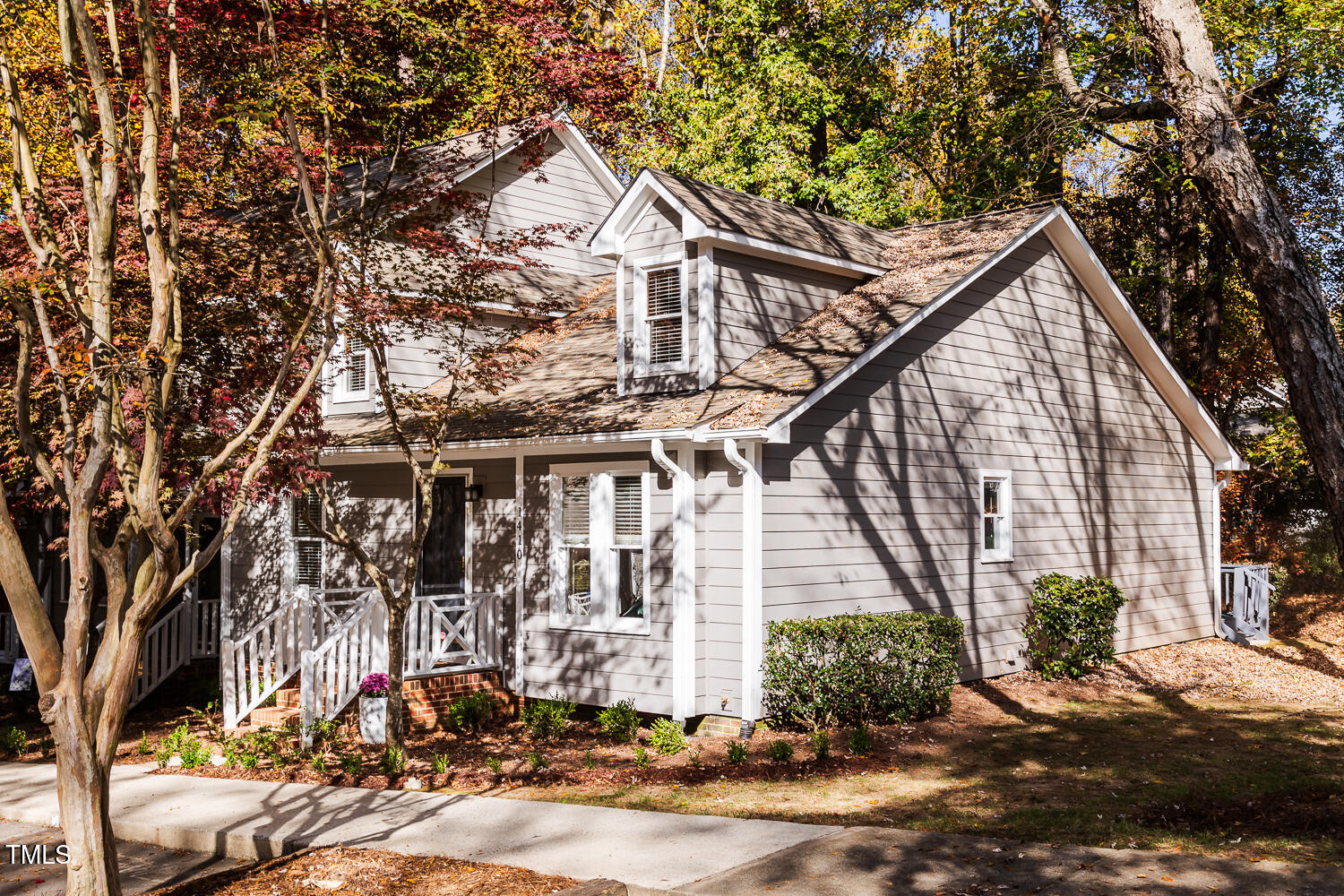 a view of a house next to a yard