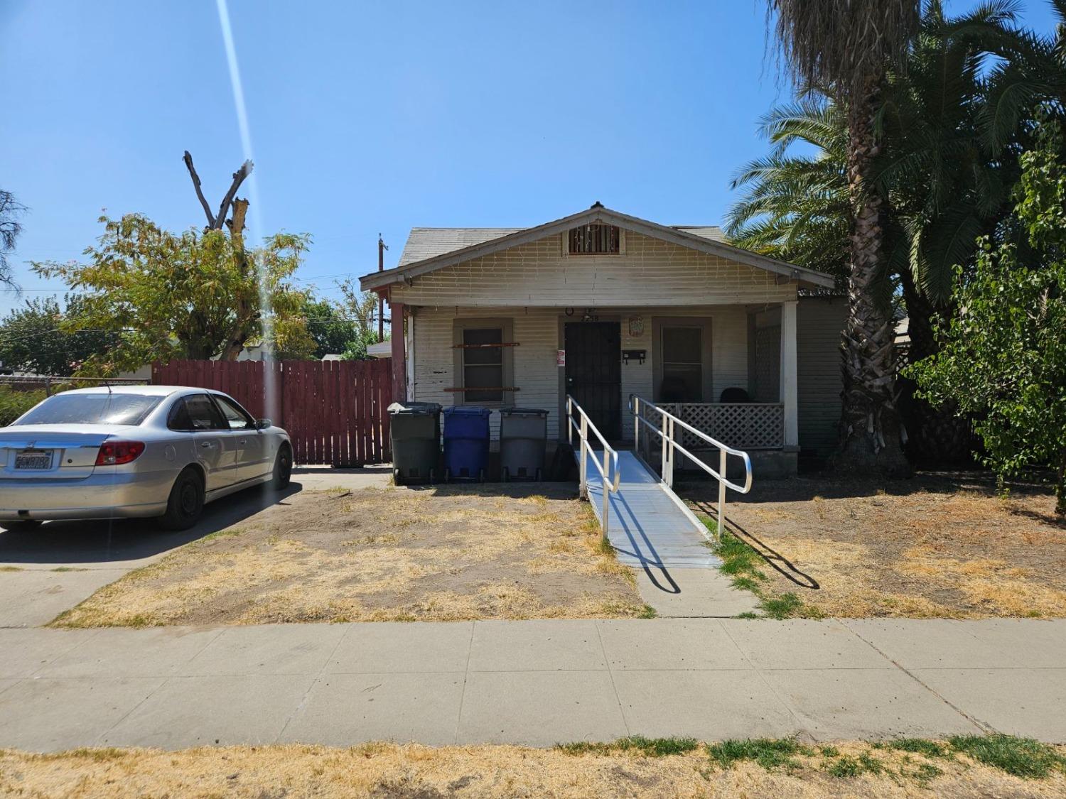 a view of a car park in front of house