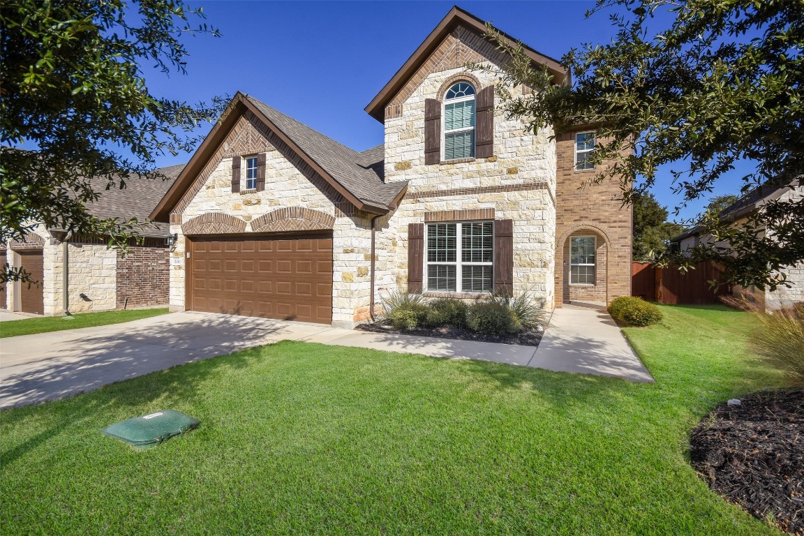 a front view of a house with a yard