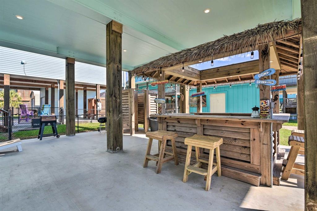 a view of a chairs and table in a patio