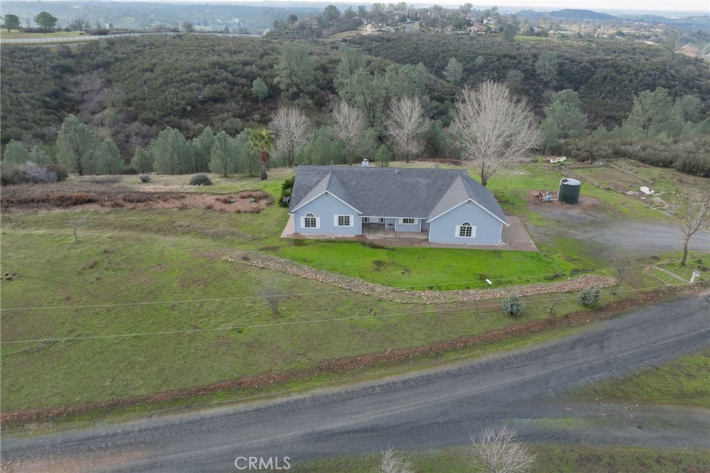 an aerial view of a house with a garden