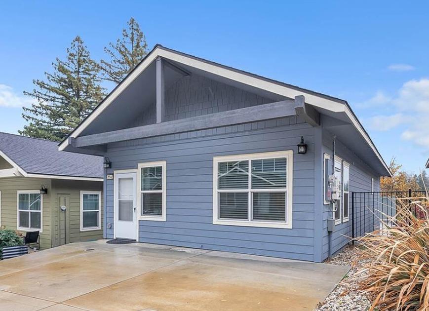 a front view of a house with a yard