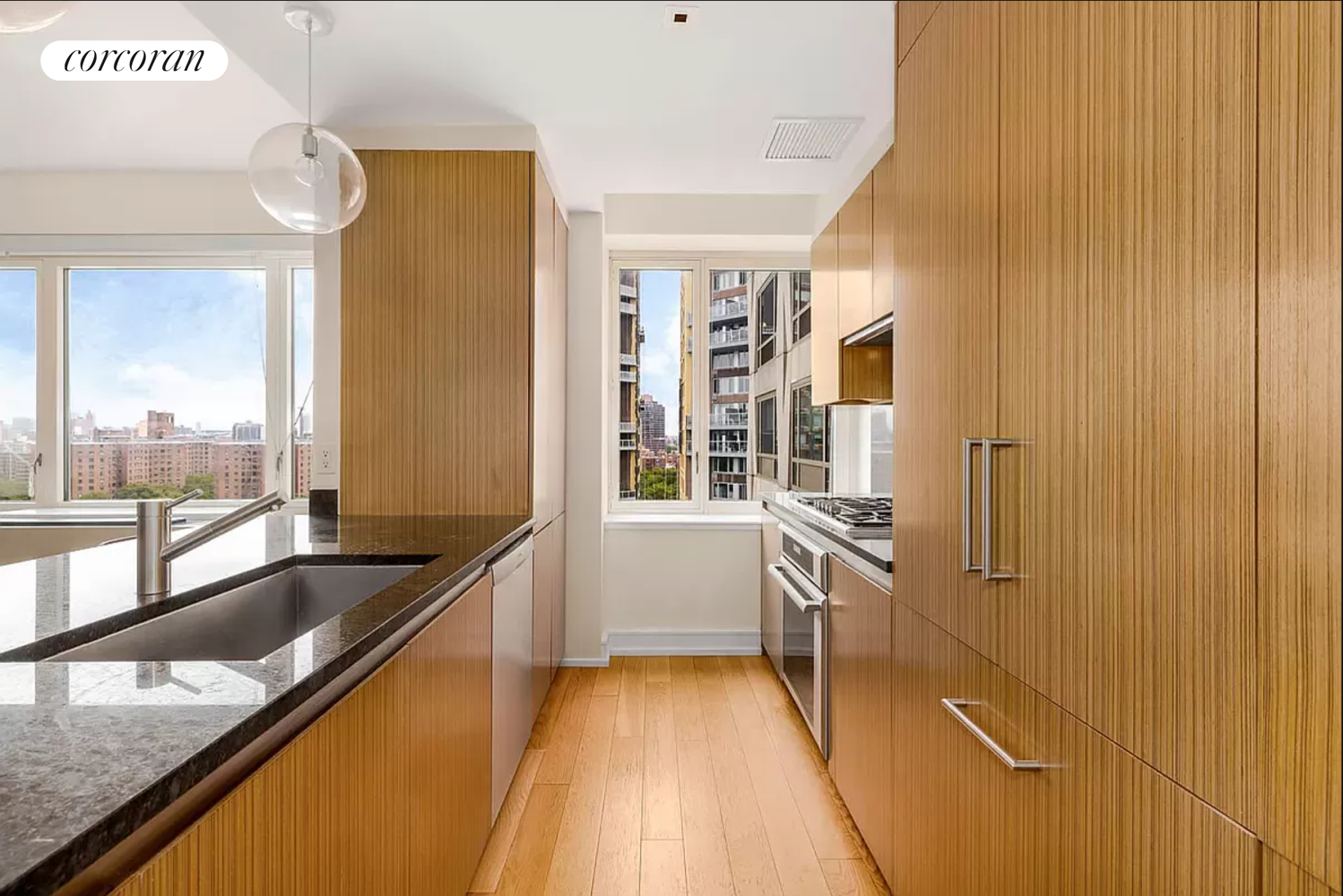 a kitchen with granite countertop a sink and stove