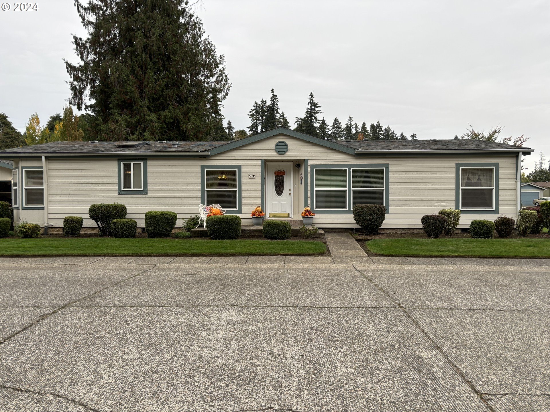 a front view of a house with yard