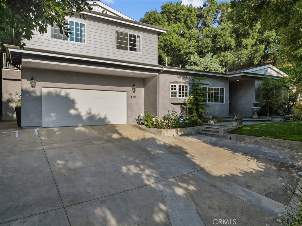 a front view of a house with yard