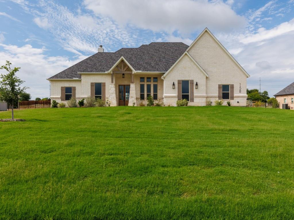 a view of a house and a yard with green space