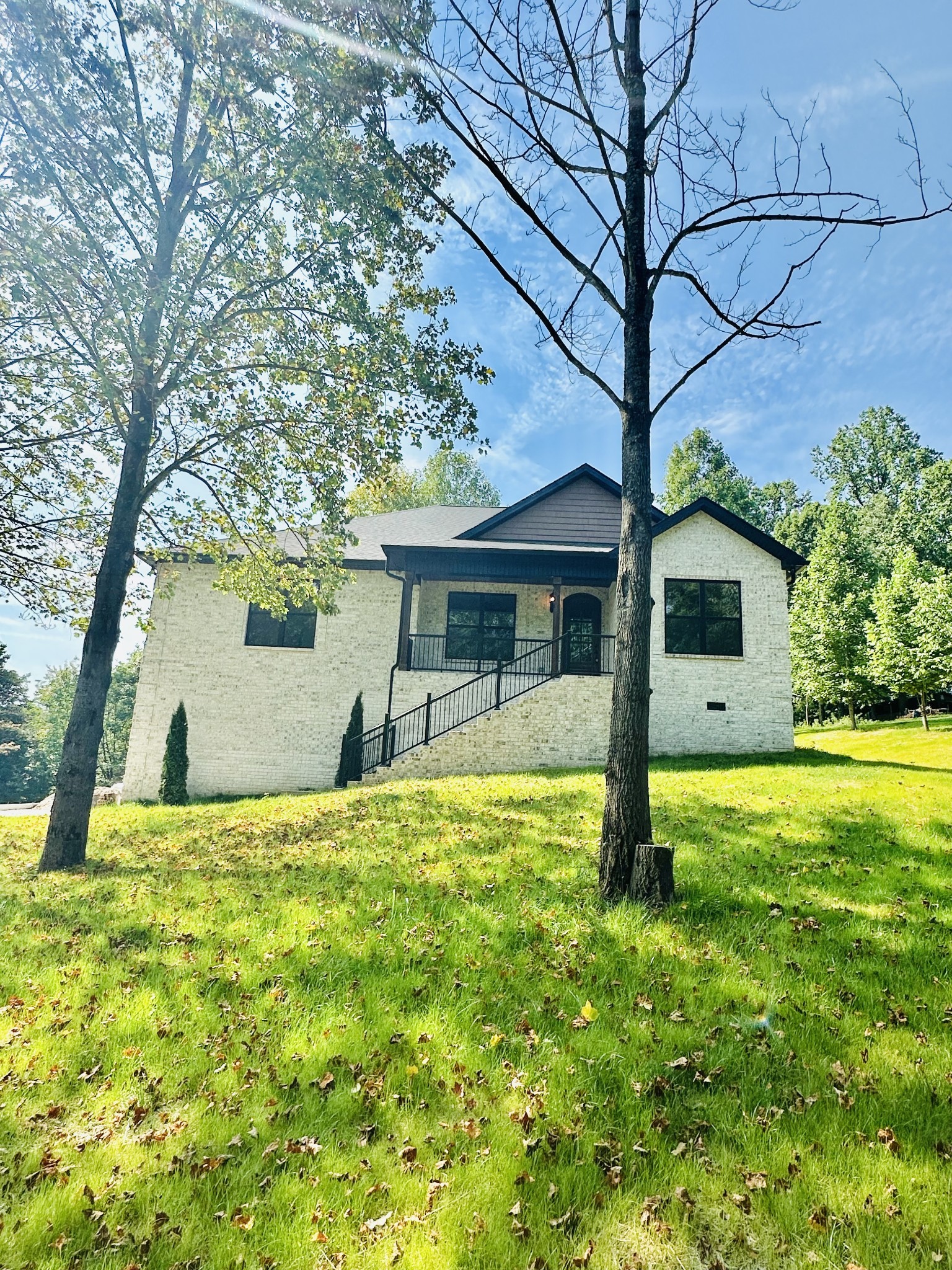 a view of a house with a yard