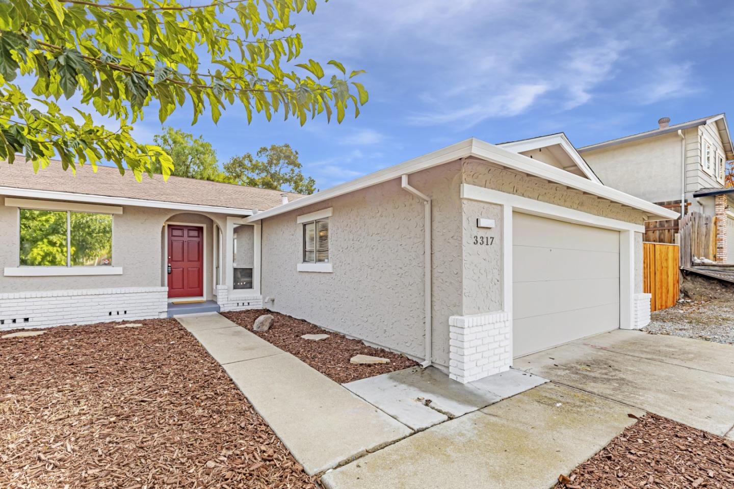 a front view of a house with a garage