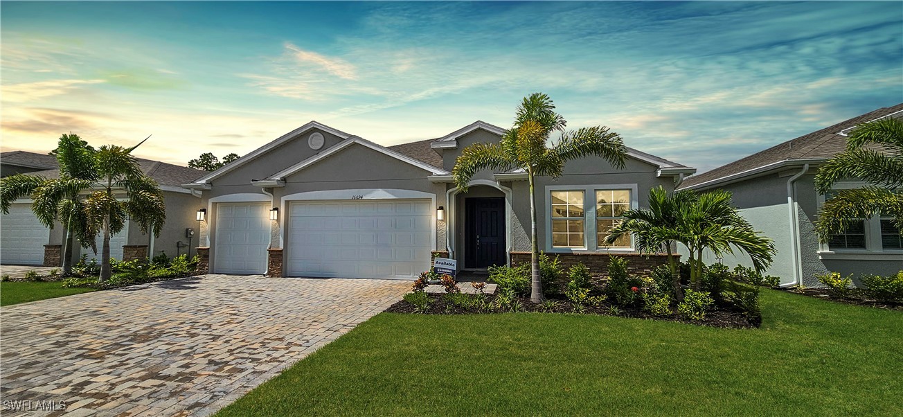 a front view of a house with a garden