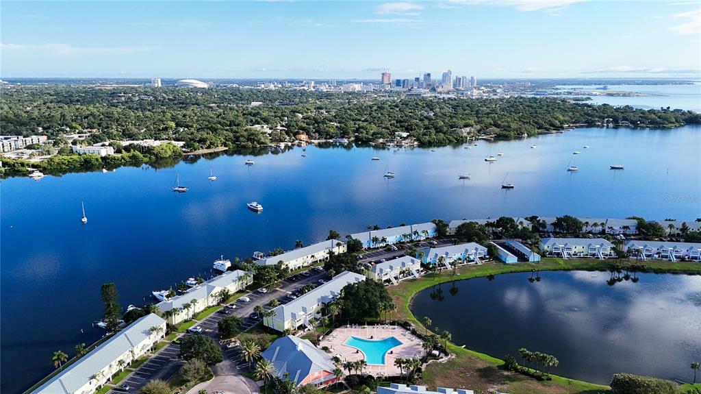 an aerial view of a houses with a lake view