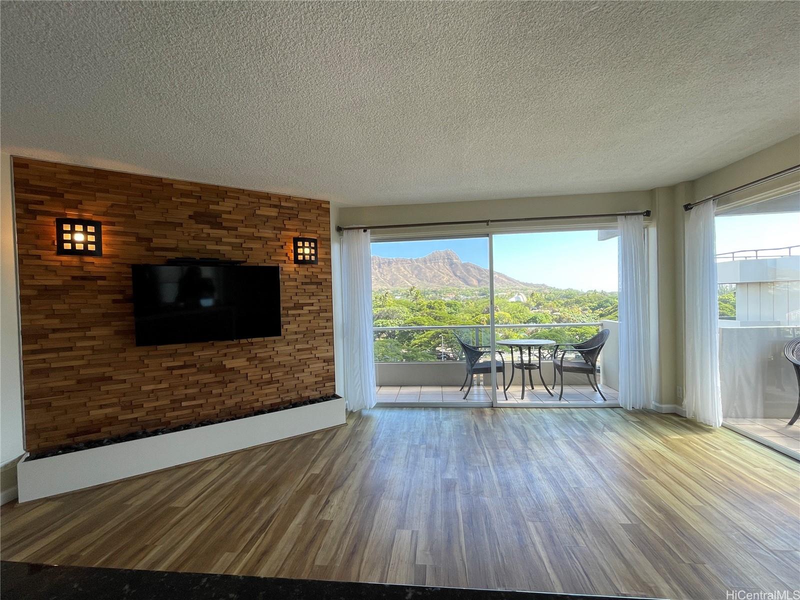 a view of livingroom with furniture window and wooden floor