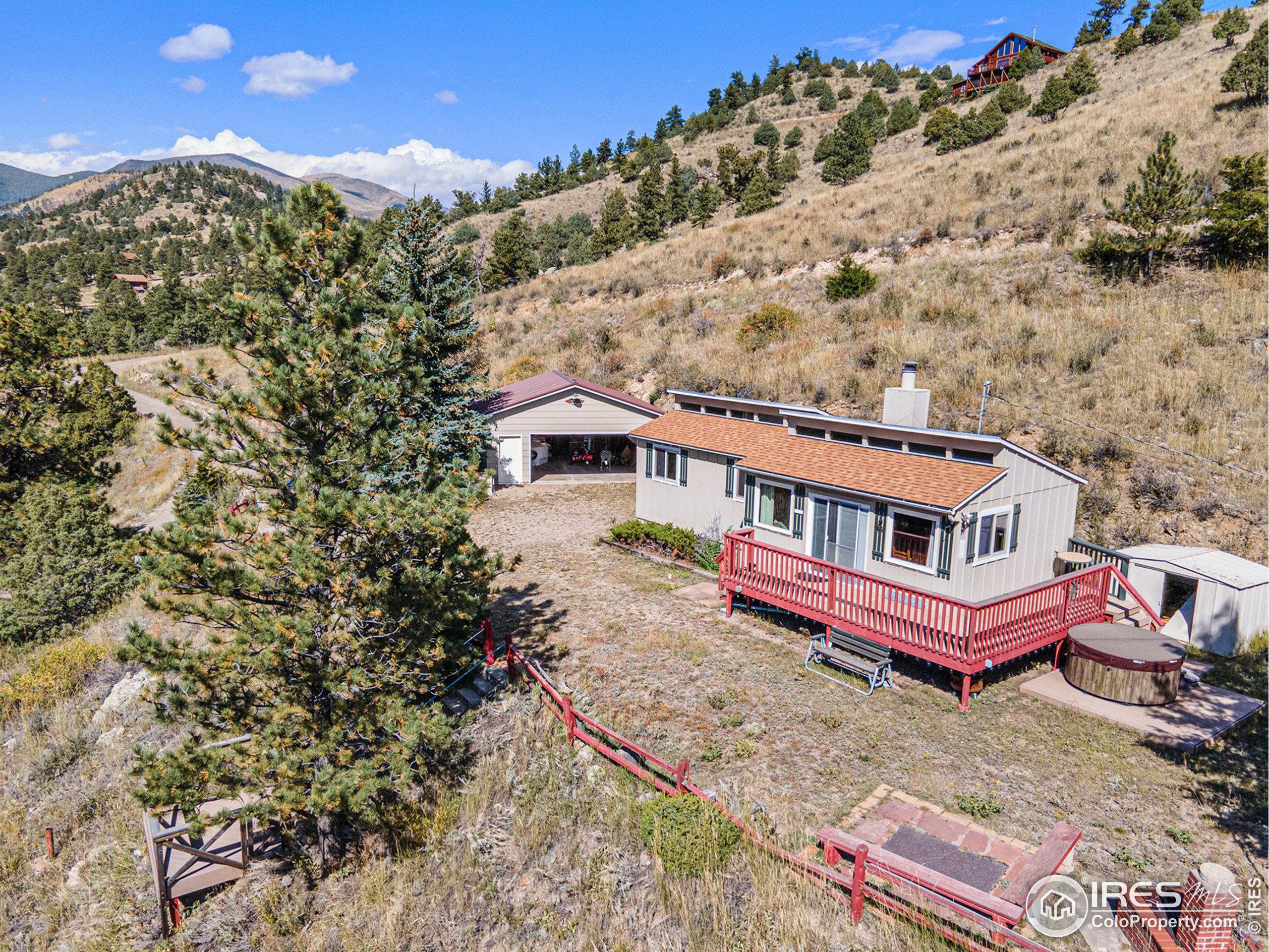 an aerial view of a house with roof deck