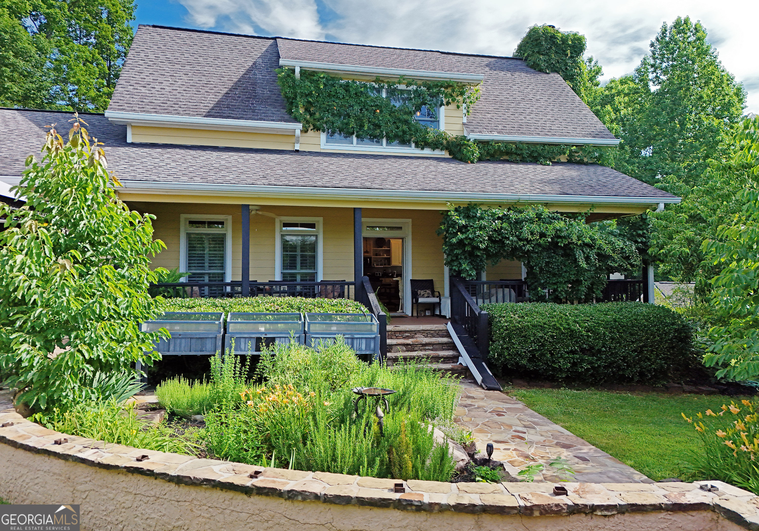 a front view of a house with a yard