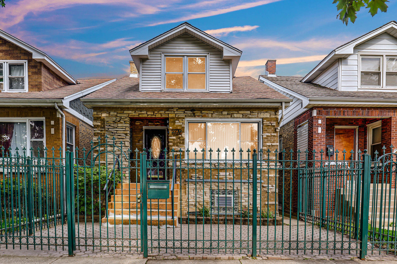 a front view of a house with a porch