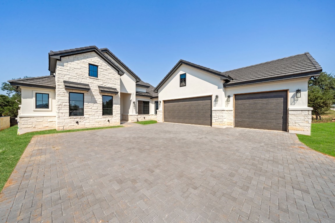 Gorgeous exterior with a 3 car garage. Grass has been digitally edited as it grass was just recently added.