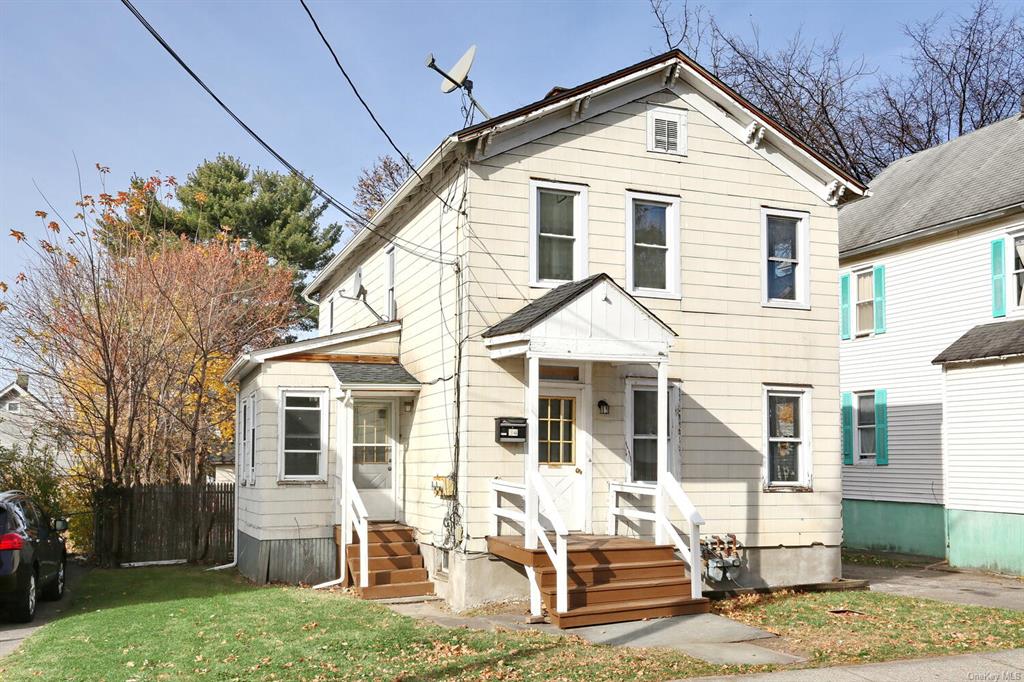 View of front of house with a front lawn