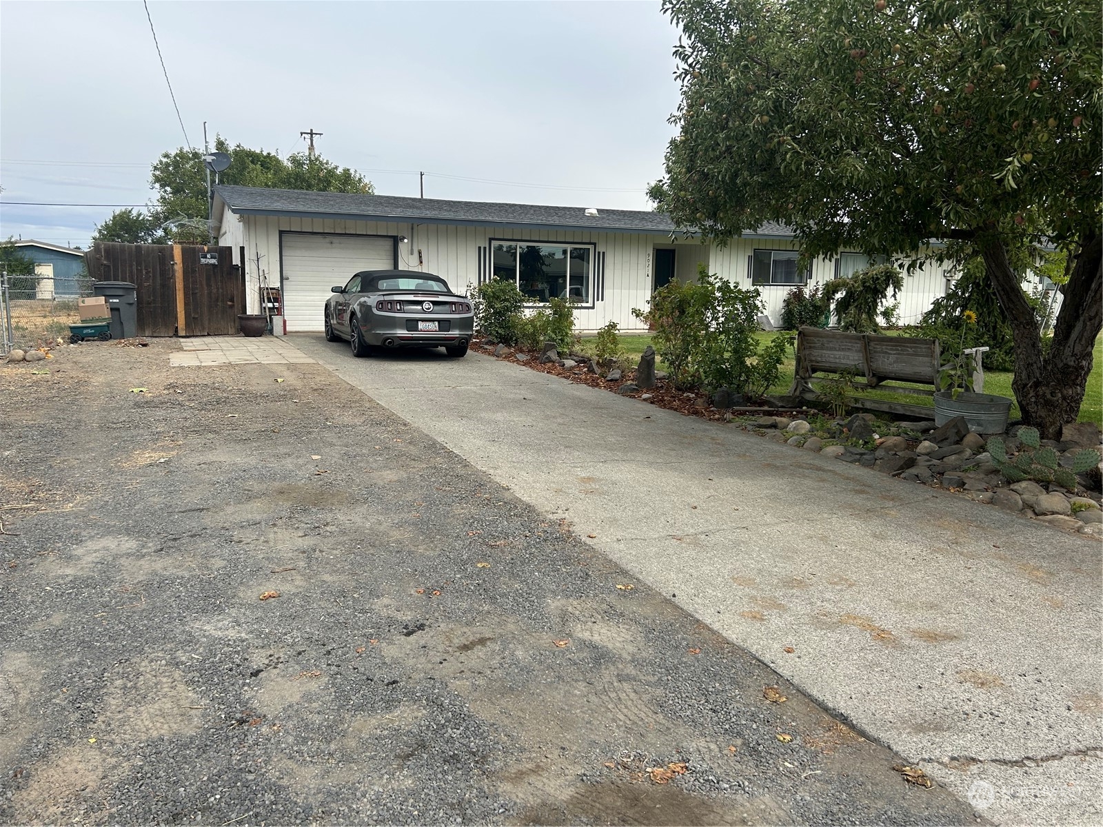 a view of a car park in front of house