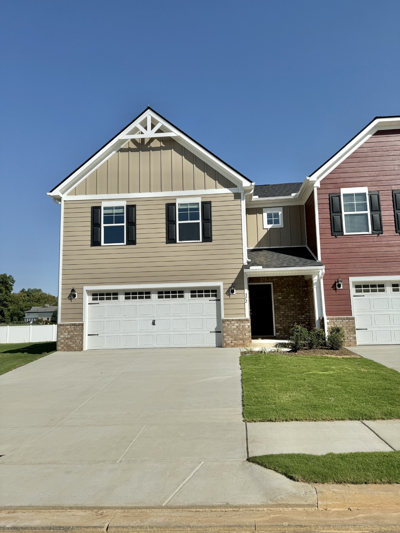 a front view of a house with yard