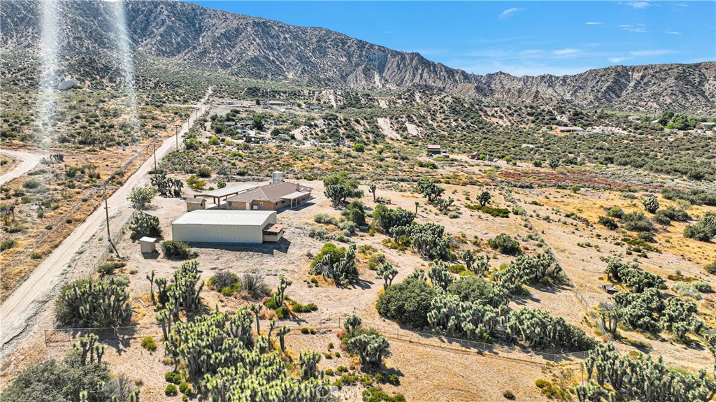 a aerial view of a house with a yard