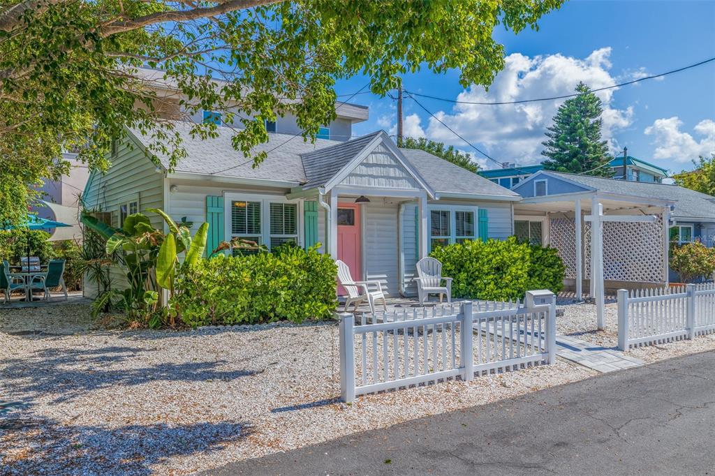 front view of a house with a bench