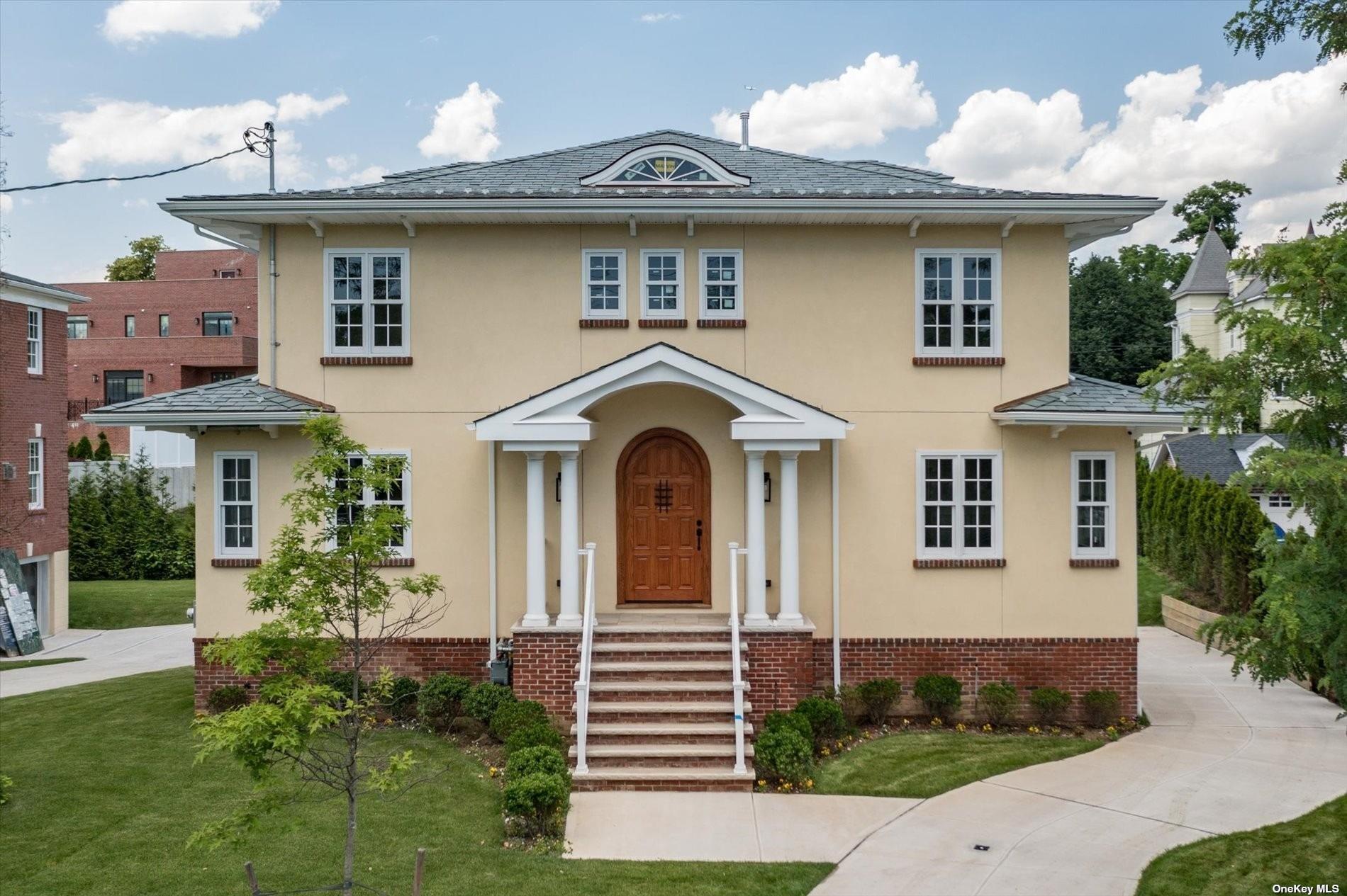 a front view of a house with a yard