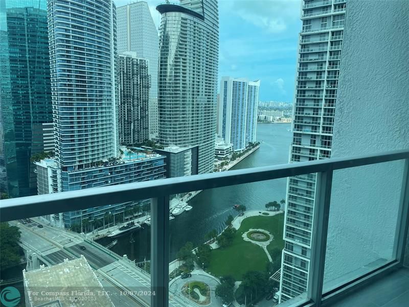 a view of swimming pool from a balcony