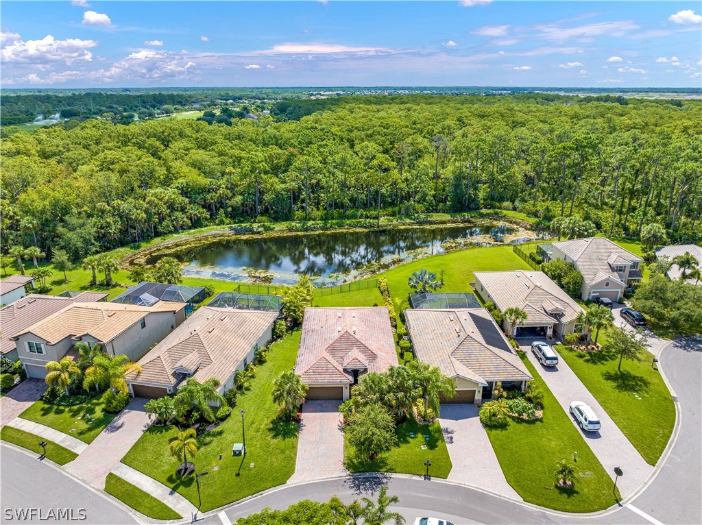 an aerial view of a house with a swimming pool yard and outdoor seating