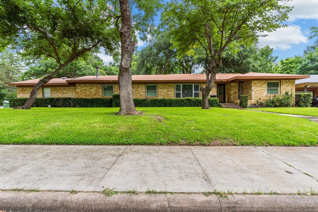 front view of a house with a yard