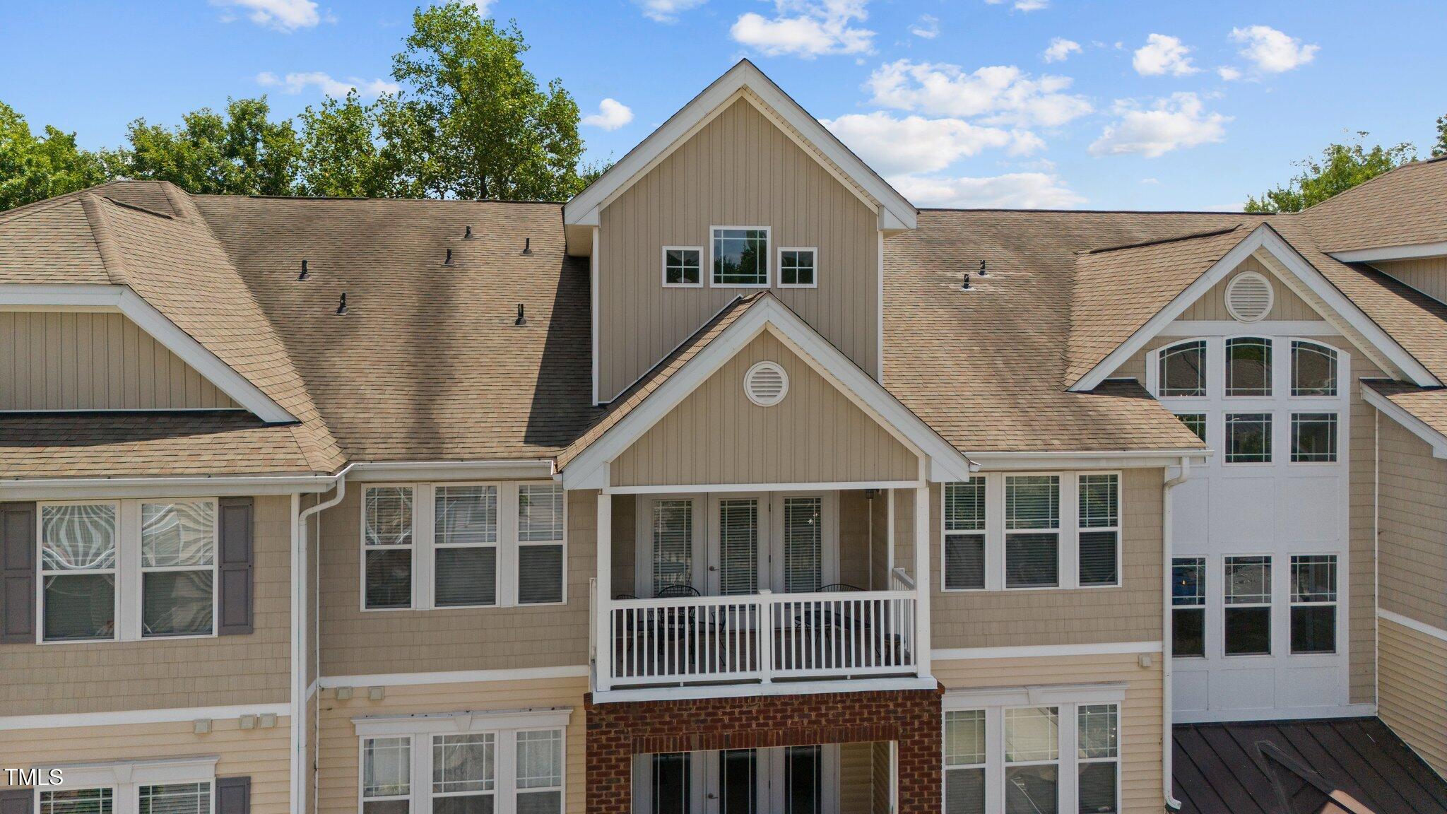 a view of multiple houses with a yard