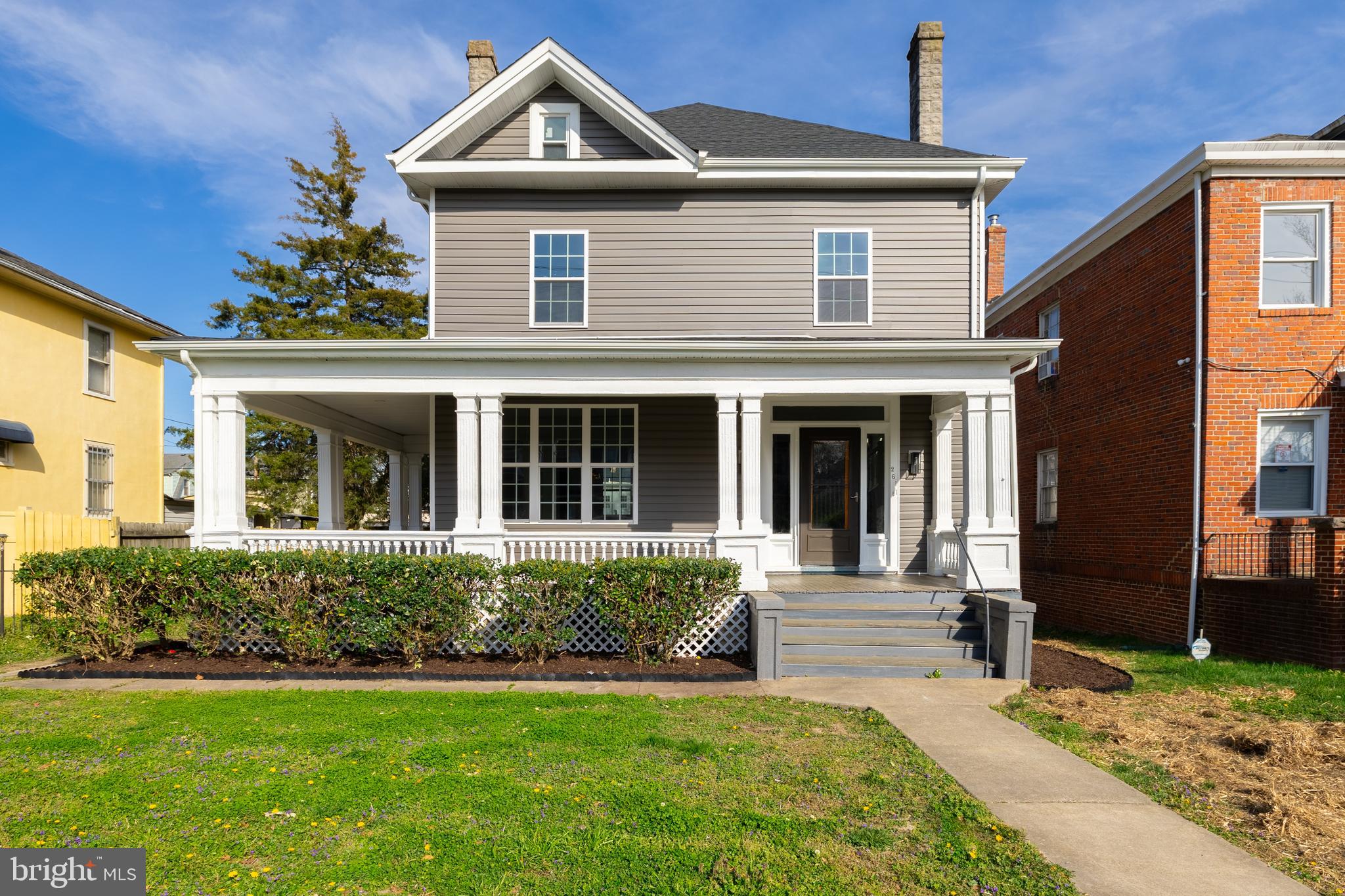 a front view of a house with a yard