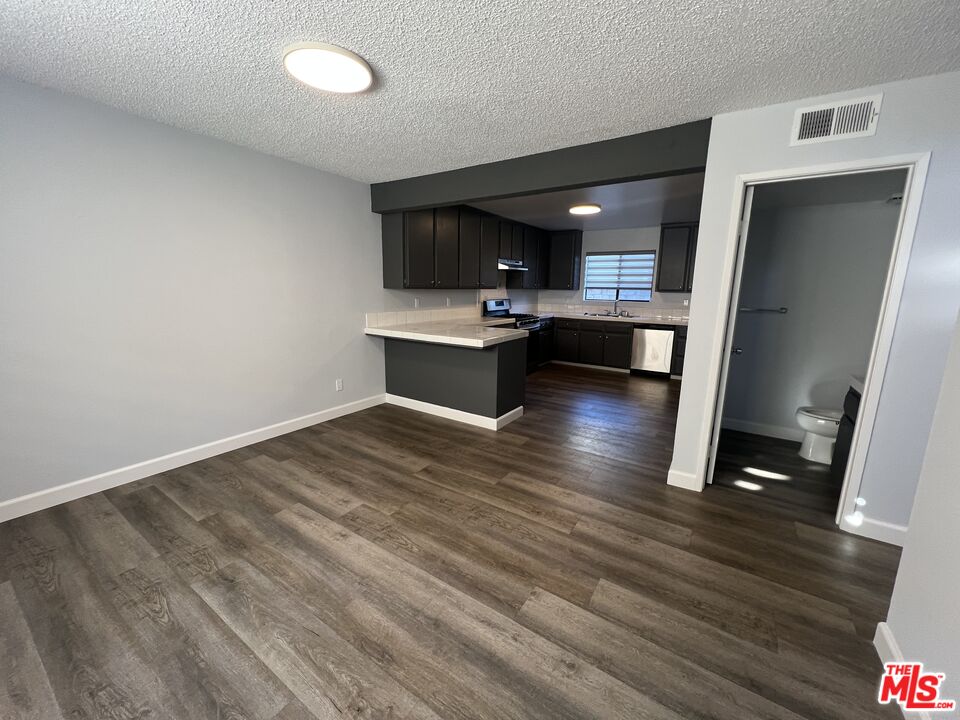 a view of a living room and hardwood floor