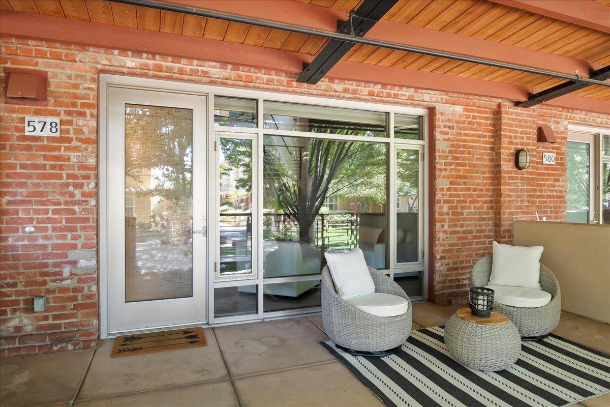 a view of a patio with couches and chairs